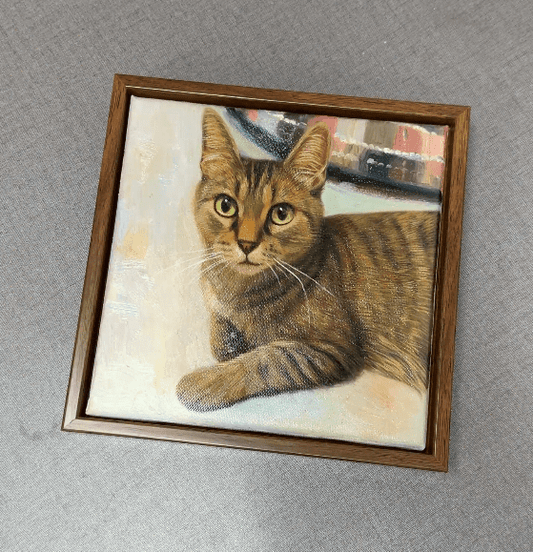 Custom cat portrait displayed on a wall, showcasing how a cat's unique expressions and personality are captured in hand-painted artwork at Bolapawzi